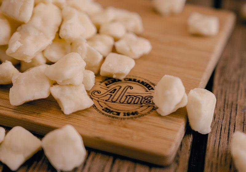 White cheese curds on Alma cutting board