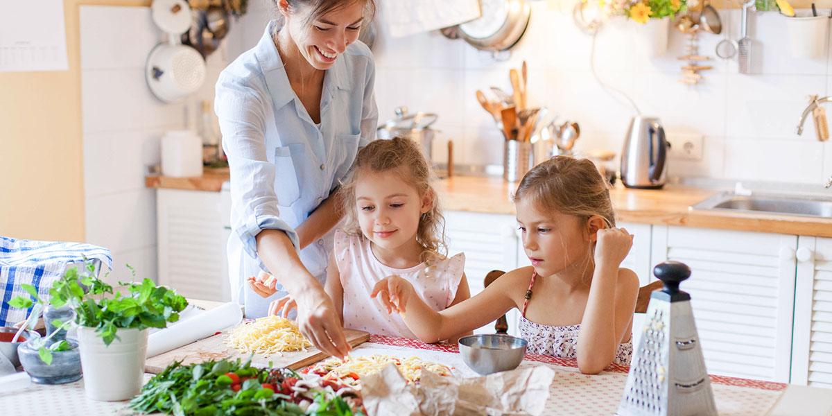 Family cooking with cheese together